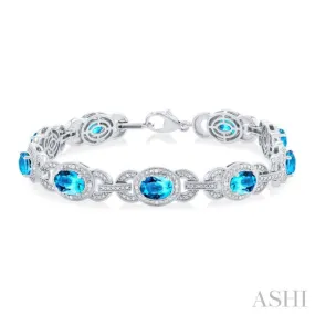 1/10 ctw Oval Cut 7x5MM Blue Topaz and Round Cut Diamond Semi Precious Bracelet in Sterling Silver