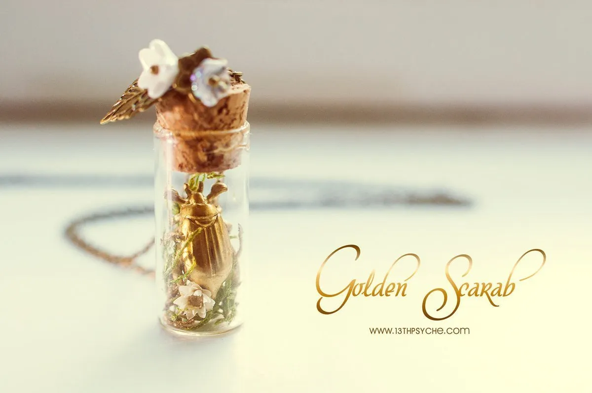 Golden beetle bottle pendant necklace