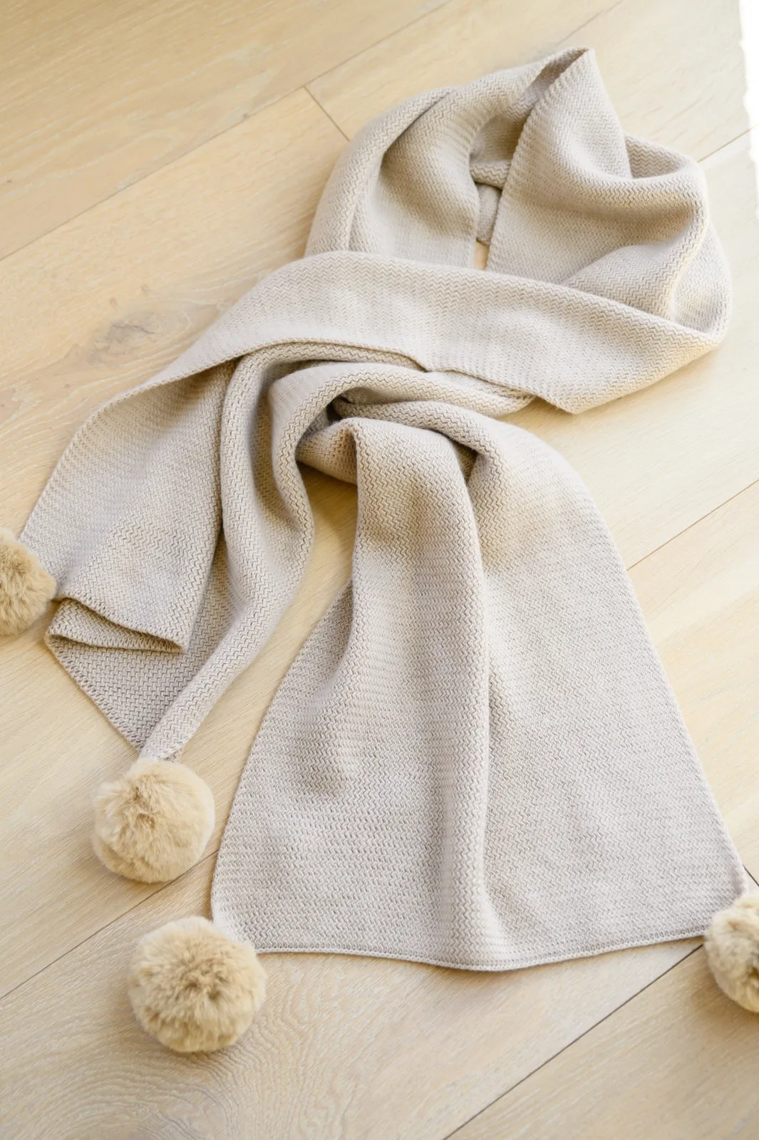 Knitted Fuzzy Pom Pom Scarf In Beige