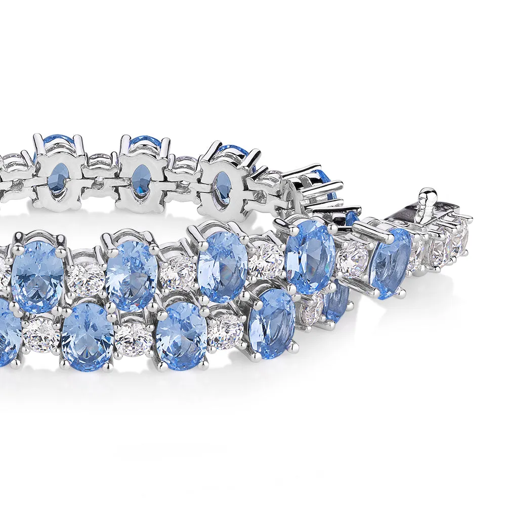 Oval and Round Brilliant tennis bracelet with blue topaz simulants and 3.26 carats* of diamond simulants in sterling silver