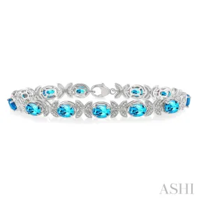 SS 0.10 CTW Round Cut Diamond and 7x5MM Oval Cut Blue Topaz Bracelet